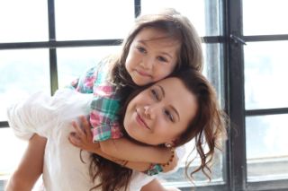 A mother and her daughter having fun together