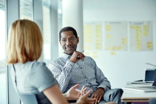 Two people having a work meeting in an office